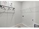 Functional laundry room with rack and shelving provides efficient utility space at 3107 Beacon Heights Rd, Indian Land, SC 29707