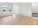 Spacious living room with large windows and hardwood floors at 3107 Beacon Heights Rd, Indian Land, SC 29707