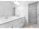 Modern bathroom featuring double sink vanity and large mirror with access to shower/tub at 3109 Beacon Heights Rd, Indian Land, SC 29707