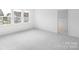 Spacious bedroom featuring plush carpeting, neutral walls, and multiple windows for natural light at 3109 Beacon Heights Rd, Indian Land, SC 29707