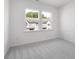 Neutral bedroom featuring carpet flooring and natural light from windows at 3109 Beacon Heights Rd, Indian Land, SC 29707