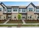 Charming townhome exterior featuring a combination of brick and siding, complemented by well-maintained landscaping at 3109 Beacon Heights Rd, Indian Land, SC 29707