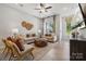 Comfortable living room features neutral tones, modern ceiling fan, and natural light at 3109 Beacon Heights Rd, Indian Land, SC 29707