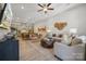 Bright, open-concept living room and kitchen with stylish decor and modern ceiling fan at 3109 Beacon Heights Rd, Indian Land, SC 29707