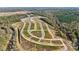 An aerial view highlighting the community's expansive layout, featuring homesites, mature trees, and winding roads at 3111 Beacon Heights Rd, Indian Land, SC 29707