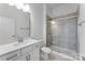 Well-lit bathroom with a tiled shower/tub combo and vanity with a neutral countertop at 3111 Beacon Heights Rd, Indian Land, SC 29707