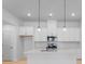 Modern kitchen with stainless steel appliances, white cabinets, and a center island at 3111 Beacon Heights Rd, Indian Land, SC 29707