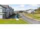 A street view showcases the community's attractive new construction townhomes and manicured lawns and landscaping at 3111 Beacon Heights Rd, Indian Land, SC 29707