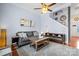 Living room features a gray sofa and a view into the kitchen at 3515 Spencer St, Charlotte, NC 28205