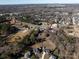 Aerial view showing home and Uptown Charlotte at 3800 Margaret Wallace Rd, Matthews, NC 28105