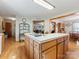 Kitchen island with cooktop and views into dining area at 3800 Margaret Wallace Rd, Matthews, NC 28105