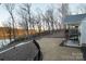 Landscaped backyard with deck overlooking lake at 42610 Moonshine Dr, New London, NC 28127