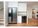 Basement kitchenette with a refrigerator and wine cooler at 42610 Moonshine Dr, New London, NC 28127