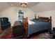 Spacious bedroom with a large bed and a vintage wooden chest, providing ample storage at 42610 Moonshine Dr, New London, NC 28127