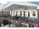 Spacious deck with multiple ceiling fans and a built-in seating area at 42610 Moonshine Dr, New London, NC 28127