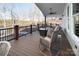 Relaxing deck overlooking a lake, complete with rocking chairs and a cozy atmosphere at 42610 Moonshine Dr, New London, NC 28127