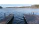 Relaxing view from a double-slip dock on calm lake water at 42610 Moonshine Dr, New London, NC 28127
