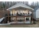 Two-story home with a large deck, offering ample outdoor space and lake views at 42610 Moonshine Dr, New London, NC 28127