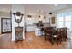 Bright kitchen with granite countertops and stainless steel appliances at 42610 Moonshine Dr, New London, NC 28127