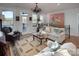 Living room with access to deck and lake views at 42610 Moonshine Dr, New London, NC 28127