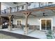 Covered patio with stone pillars and a dining set, ideal for outdoor entertaining at 42610 Moonshine Dr, New London, NC 28127