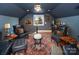 Relaxing sitting area with leather armchairs and a large area rug, perfect for unwinding at 42610 Moonshine Dr, New London, NC 28127