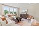 Bright living room with a large sectional sofa, coffee table and rug at 5033 Westmead Ln, Charlotte, NC 28262