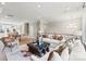 Open living room with sectional sofa, coffee table and views into kitchen area at 5033 Westmead Ln, Charlotte, NC 28262