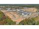 Aerial view of townhomes under construction near a river at 5037 Westmead Ln, Charlotte, NC 28262