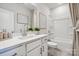 Clean bathroom showcasing a spacious vanity with white quartz counters and a shower-tub combo at 5037 Westmead Ln, Charlotte, NC 28262