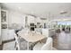 Bright dining area features a modern table and chairs next to the open-concept kitchen at 5037 Westmead Ln, Charlotte, NC 28262