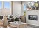 Bright, modern living room features comfortable seating, and fireplace at 5037 Westmead Ln, Charlotte, NC 28262