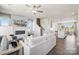Open-concept living room with modern fireplace, comfortable seating, and seamless flow to the kitchen at 5037 Westmead Ln, Charlotte, NC 28262