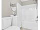 Clean bathroom with white vanity, toilet, and a bathtub/shower combo at 550 Woodleaf Barber Rd, Cleveland, NC 27013