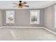 Bedroom with ceiling fan and large windows at 550 Woodleaf Barber Rd, Cleveland, NC 27013