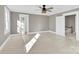 Bright bedroom with neutral walls, carpet, and ceiling fan at 550 Woodleaf Barber Rd, Cleveland, NC 27013