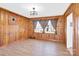 Spacious dining room featuring wood paneling and a view at 550 Woodleaf Barber Rd, Cleveland, NC 27013