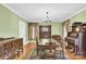 Dining room features hardwood floors, antique furniture, and a view at 550 Woodleaf Barber Rd, Cleveland, NC 27013