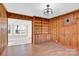 Bright dining room with built-in shelving and wood paneling at 550 Woodleaf Barber Rd, Cleveland, NC 27013