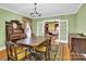 Bright dining room with antique table and built-in hutch at 550 Woodleaf Barber Rd, Cleveland, NC 27013