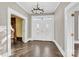 Bright entry with hardwood floors, chandelier, and elegant double doors at 550 Woodleaf Barber Rd, Cleveland, NC 27013