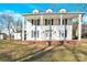 Two-story white house with a large front porch and brick steps at 550 Woodleaf Barber Rd, Cleveland, NC 27013