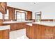 Kitchen boasts wood cabinets, an island, and a window view at 550 Woodleaf Barber Rd, Cleveland, NC 27013