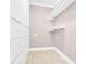 Laundry closet with built-in shelving and drawers at 550 Woodleaf Barber Rd, Cleveland, NC 27013