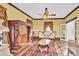 Living room with ornate fireplace and antique furniture at 550 Woodleaf Barber Rd, Cleveland, NC 27013