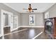 Living room with hardwood floors, fireplace, and French doors at 550 Woodleaf Barber Rd, Cleveland, NC 27013