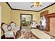 Living room with antique furniture and a view into the dining room at 550 Woodleaf Barber Rd, Cleveland, NC 27013