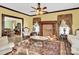 Living room features ornate fireplace, hardwood floors, and antique furnishings at 550 Woodleaf Barber Rd, Cleveland, NC 27013