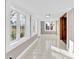 Sunroom with tile flooring, multiple windows, and access to the outdoors at 550 Woodleaf Barber Rd, Cleveland, NC 27013