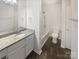 Bathroom with granite vanity and tub shower combo at 6041 Pinebark Ct, Charlotte, NC 28212